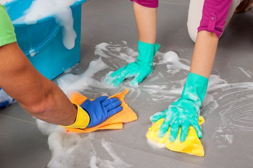 After builders cleaning team clearing dust in a Fulham home