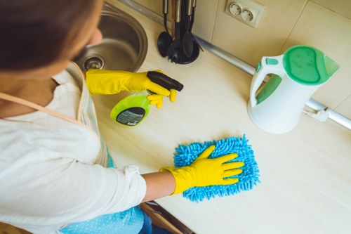 Local cleaners removing construction dust from windows and floors