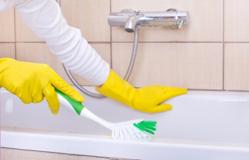 Cleaner preparing a Fulham home for a regular housekeeping visit